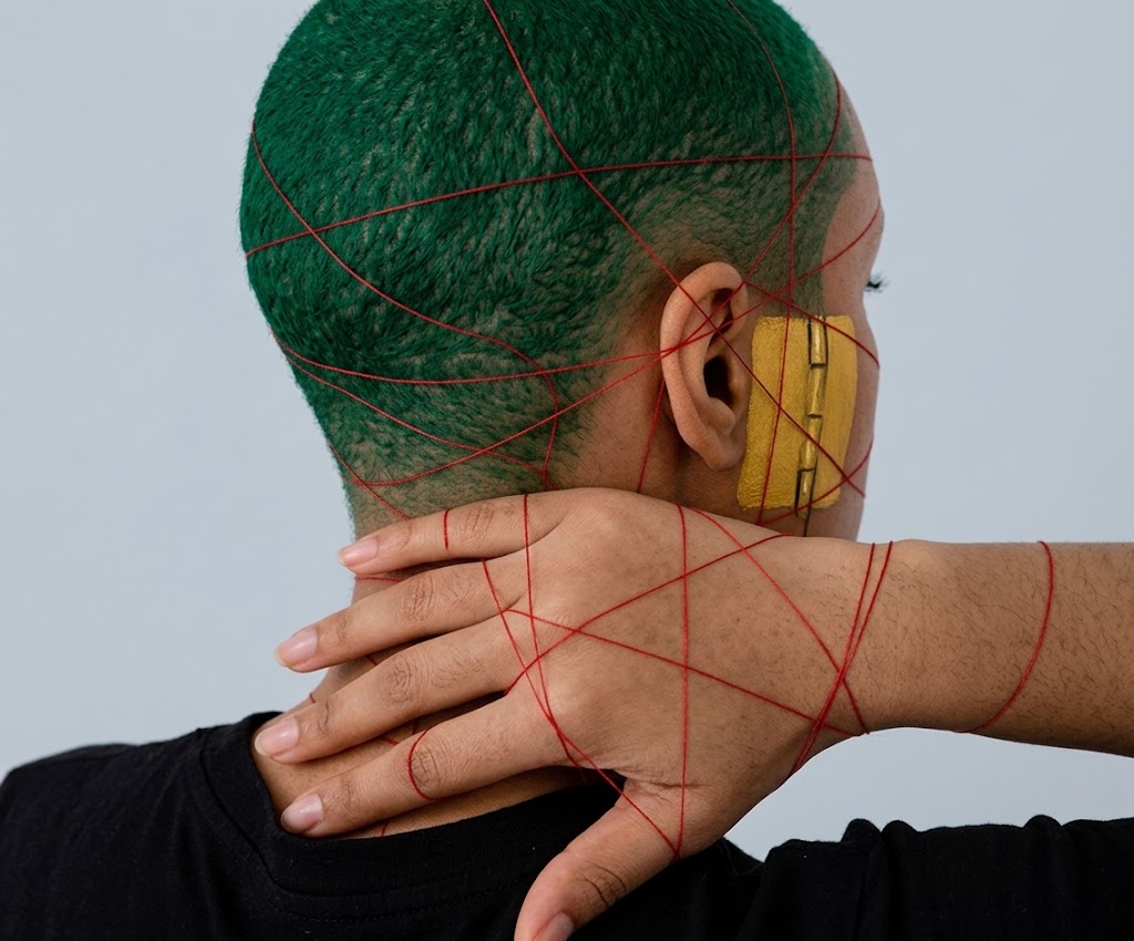 Jamaican portrait with red connecting threads